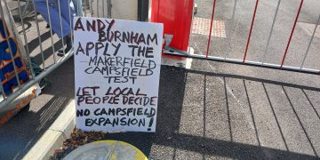 Sign reading "Andy Burnham let local people decide NO Campsfield expansion!"